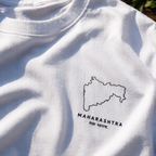 White oversized t-shirt with a black outline of Maharashtra and text on a white background