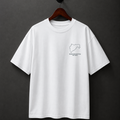 White t-shirt with a small logo on a hanger against a dark background