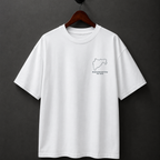 White t-shirt with a small logo on a hanger against a dark background